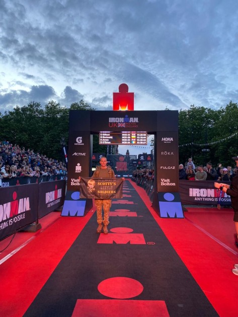 Alan waving the Scotty's flag at the finish line