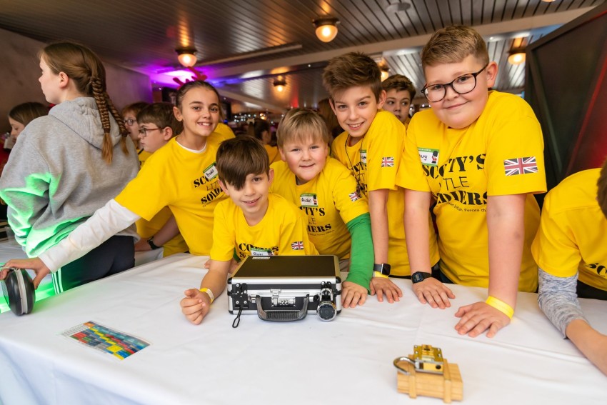 Some Scotty Members in yellow Scotty shirts at our 2019 Christmas party